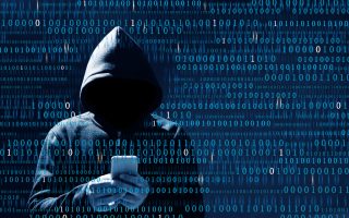 Computer hacker using mobile phone